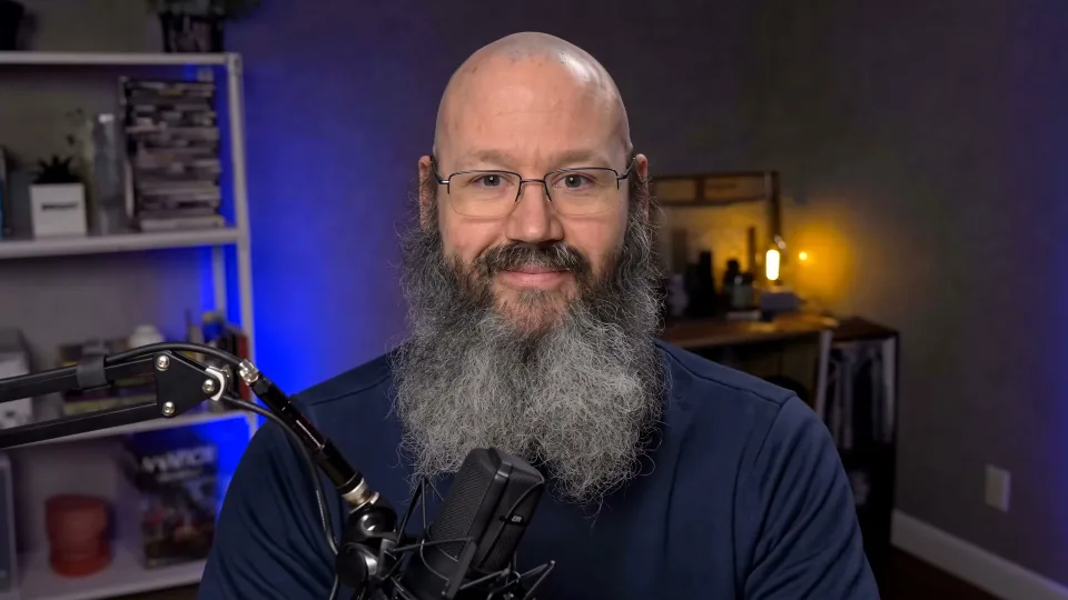 Scott Somers at a microphone in his recording room